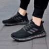Popular men's breathable flying woven sneakers casual mesh shoes Popcorn sole running shoes 39-44
